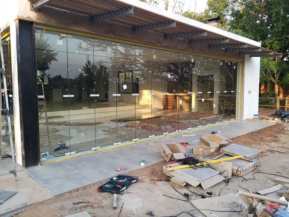 Frameless glass facade installed by MZSteel